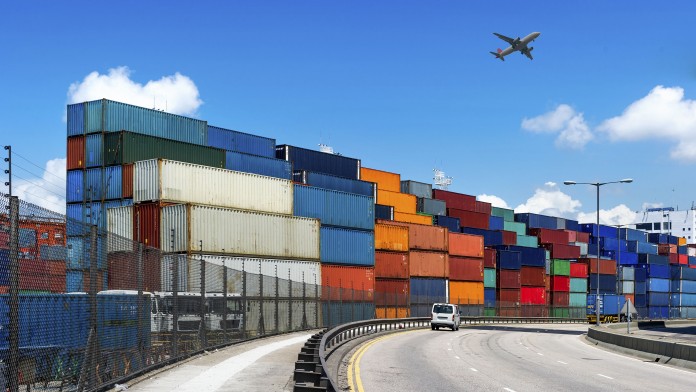 Many Container, an airplane and a big road