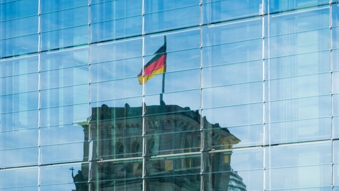 German flag reflects on a building